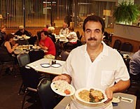 Jennifer's Cafe: Owner/chef Jack Suidan serves Maurice salad and salmon Florentine. - Metro Times Photo / Larry Kaplan