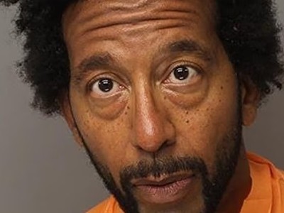 Devereaux Johnson was charged with first-degree murder for allegedly shooting his neighbor following a dispute over mulch.