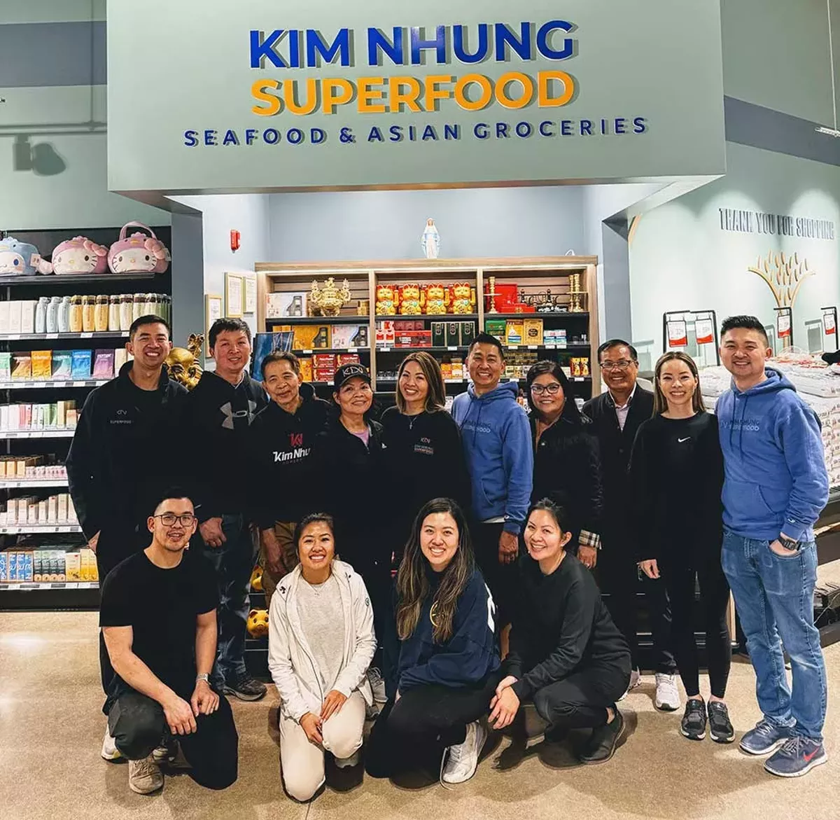 Image: Three generations of the Kim Nhung Superfood family gather in the newly expanded store in Madison Heights.