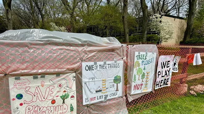 Children drew colorful signs in protest of the steam project near their playground.