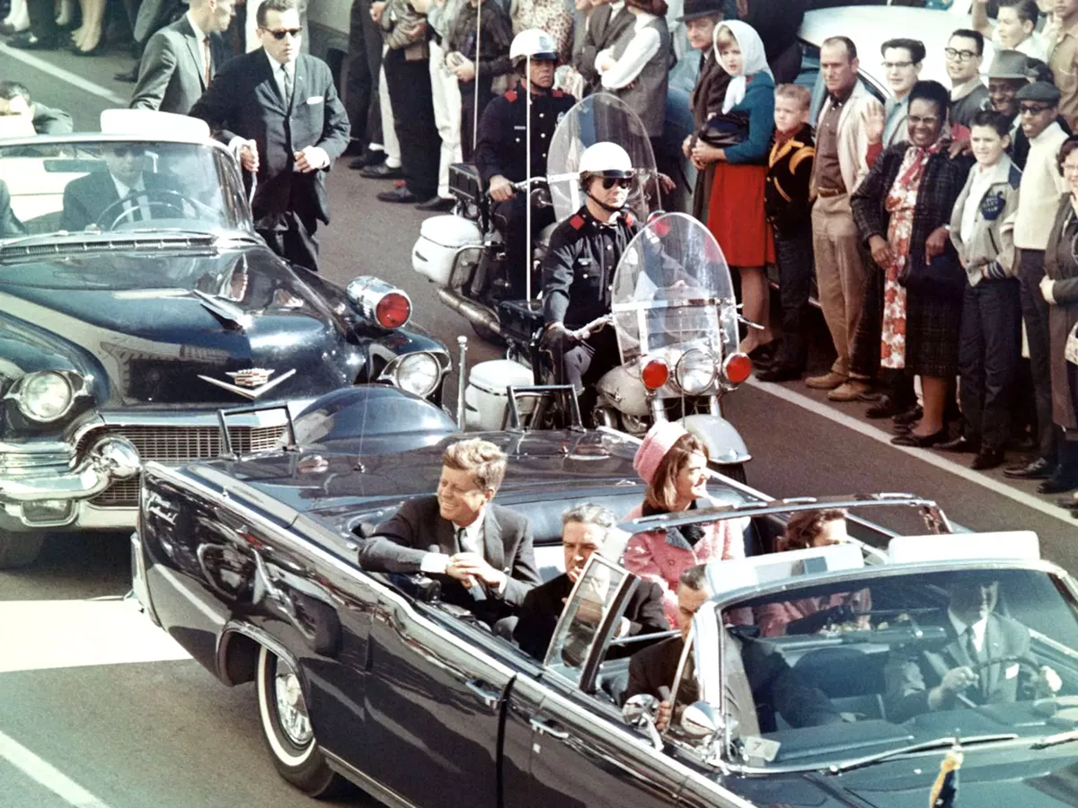 Image: President John F. Kennedy in the limousine in Dallas, minutes before he was assassinated. The car is on display at the Henry Ford museum in Dearborn.