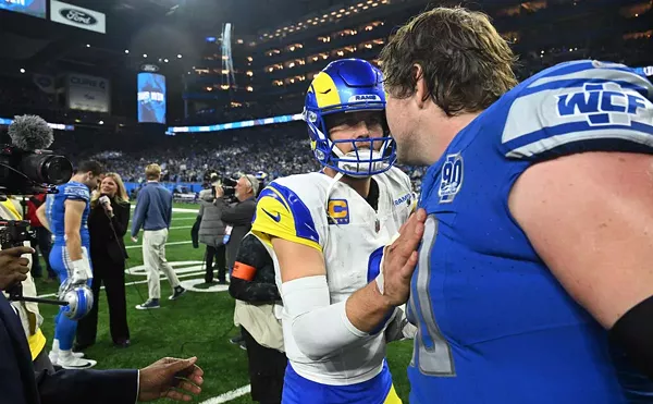 Los Angeles Rams QB Matthew Stafford congratulates Detroit Lions guard Graham Glasgow while walking off the field following the game between Los Angeles Rams and Detroit Lions on Jan. 14 at Ford Field.