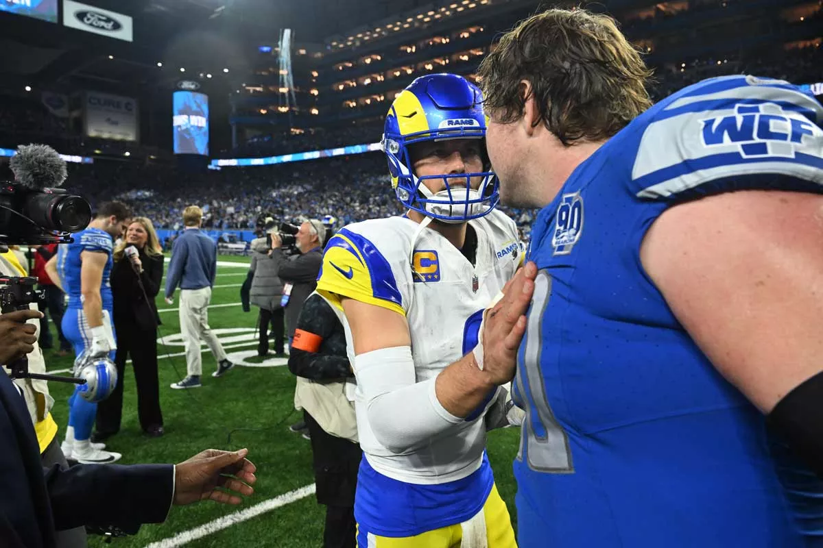 Image: Los Angeles Rams QB Matthew Stafford congratulates Detroit Lions guard Graham Glasgow while walking off the field following the game between Los Angeles Rams and Detroit Lions on Jan. 14 at Ford Field.