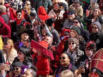 Attendees dress in red at the Marche du Nain Rouge.