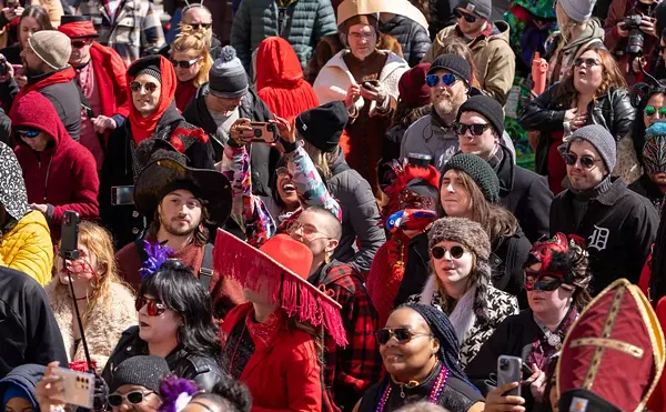 Attendees dress in red at the Marche du Nain Rouge.