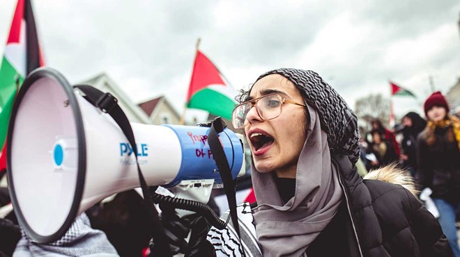 A young woman speaks at an antiwar protest in Hamtramck.