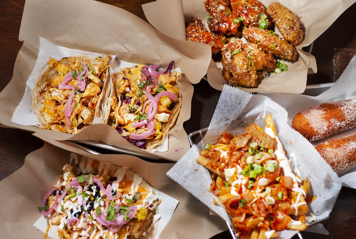 From bottom left: Fish taco, bulgogi and spicy pork tacos, wings, moz dogs, and kimchi fries.