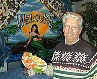 Mariscos co-owner Jesus Servin serves filet of catfish with rice - Metro Times Photo / Larry Kaplan
