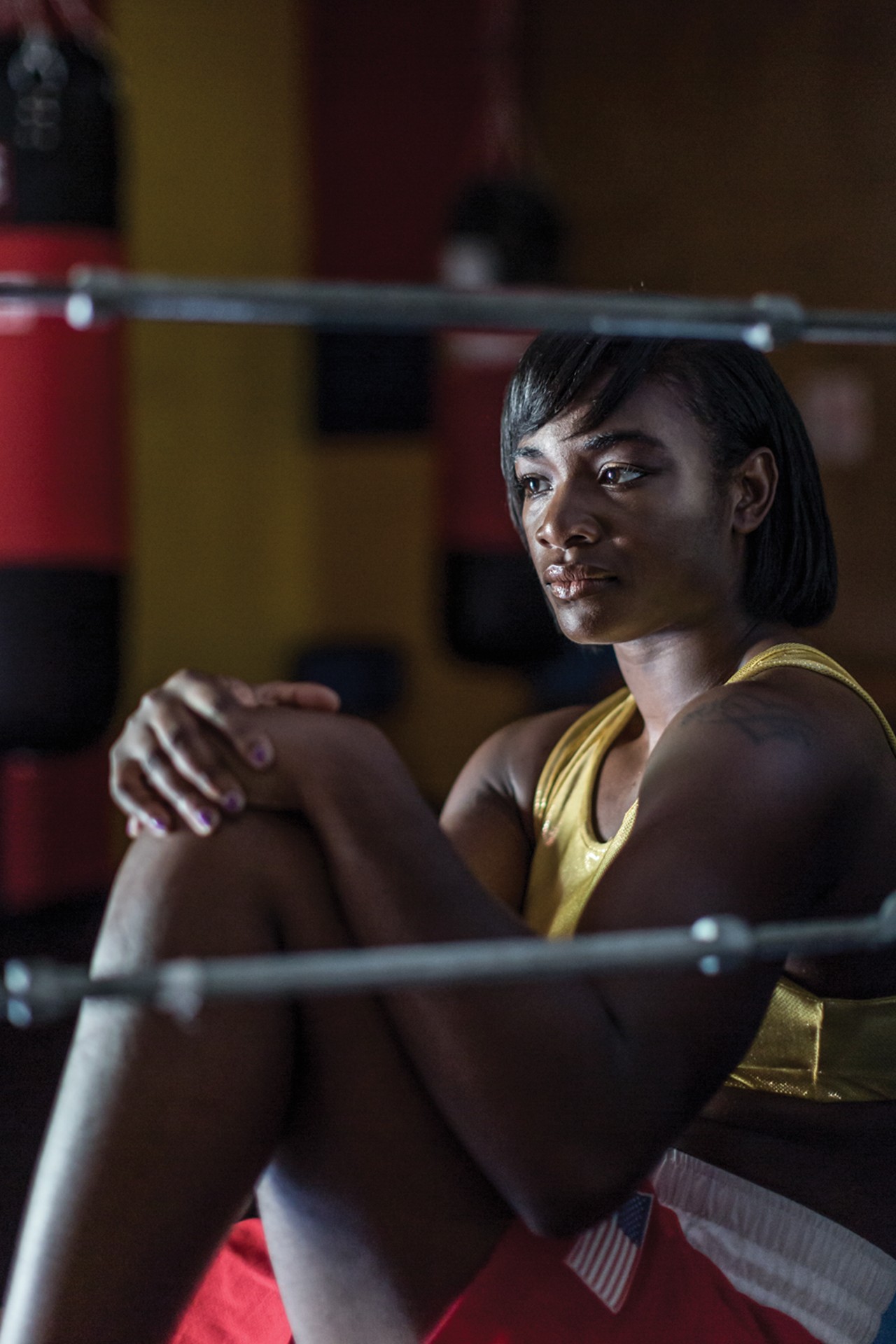 The Boxer:&nbsp;Claressa Shields
Professional Boxer and two-time Olympic Gold Medalist
&nbsp;
Claressa Shields grew up in Flint, a city long-besieged by wayward economic forces and, for the last three years, a seemingly never-ending water crisis. Her mother abused substances and her mother's boyfriend was abusive, so for many years, she lived with her grandmother. 
Shields, 22, didn't meet her father until she was 9. He spent seven years in prison, and they met upon his release. While getting to know one another, he told his daughter he wished he'd just followed his passion in life &mdash; if he'd done that, things would be different.
"After being in prison for seven years, he got out and even though he served his time, he was treated like a convict and he couldn't get a job because he was a convicted felon," Shields says. "He felt like he had served his time, but they were still punishing him. He said if he had stuck to what he was passionate about, he wouldn't have been in the situation he was in. I just asked what he was passionate about and he said boxing. I thought if I were ever to do something big for my dad, it would be boxing. "
Tough from a young age, Shields says she could hold her own against the boys at school. "I could slam guys," she says. "I was able to do that stuff when I was younger."
By 11, she wandered into a local gym and began beating on the boys with such a fury that coach Jason Crutchfield could no longer ignore her innate talent, her obvious strength. But when she asked her dad to sign her up for boxing lessons, she didn't get the answer she expected. 
"He said no. [He said] boxing was a man's sport and added on that I was too pretty to box," Shields says. 
Egged on by her grandmother, Shields continued to train and eventually moved in with Crutchfield and his wife, becoming a family member as well as a mentee. 
Under Crutchfield's tutelage, a 16-year-old Shields qualified for the 2012 Olympics, where she competed against women whose experience far exceeded her own. Against all odds, she came home from London with a gold medal.
There is no doubt in Shields mind that she is the best boxer there is. She will tell you as much. Yet, the type of success male boxers experience has eluded her. Even after making history at the Olympics, she couldn't get a sponsorship deal. Brands were not clamoring to endorse her. It's been a slow, rocky journey and it's nowhere near over.
In 2016, Shields returned to the Olympics and came home with another gold medal, making her the only American Olympic boxer to win the title consecutively. Since then, the pace of her ascension to fame and fortune has moved from glacial to simply unhurried. She recently won a Nickelodeon Kids' Choice Sports award, an honor she seems as grateful for as those gold medals. 
But, what she really wants is money. She wants a million-dollar fight. On Aug. 4,  after only four matches as a professional boxer, she went up against 30-year-old, undefeated Nikki Adler at the MGM Grand Detroit for the World Boxing Council super middleweight title &mdash; and won. 
The fight was Shields' second for Showtime, an opportunity that surely came with some cash. Yet, until women boxers are earning seven-figures per fight, Shields isn't going to stop demanding what she deserves. 
"I want to break those barriers and erase those lines between women's boxing and men's boxing. I want to be there when we get equal pay and we have the same opportunity as men to box," she says. "Women should get equal pay and equal TV time and I hope by the end of my career, we're over that hump." 
By Alysa Zavala-Offman
