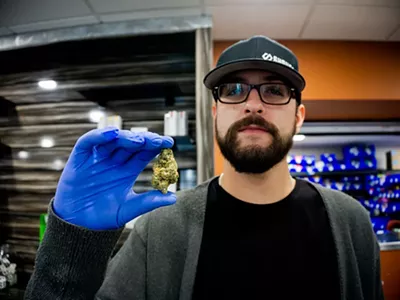An employee shows off a nug at Hazel Park's dispensary Shango.