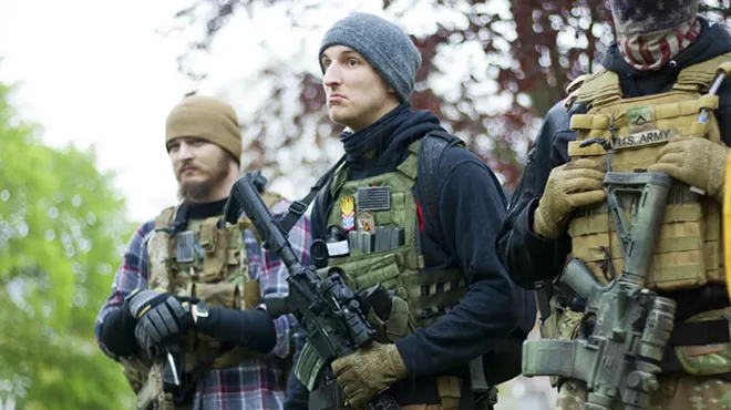 Armed protesters at a rally against Michigan's COVID-19 restrictions in May 2020.