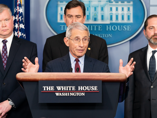 Dr. Anthony Fauci, center, is the Trump whisperer.