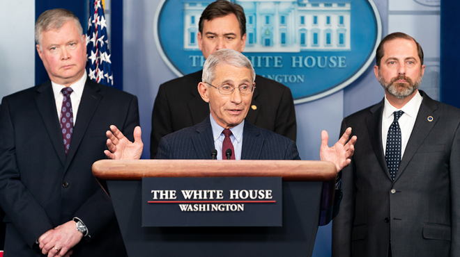 Dr. Anthony Fauci, center, is the Trump whisperer.