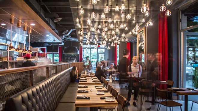 Inside of Townhouse Detroit, a bar and restaurant located in Ally Detroit Center.