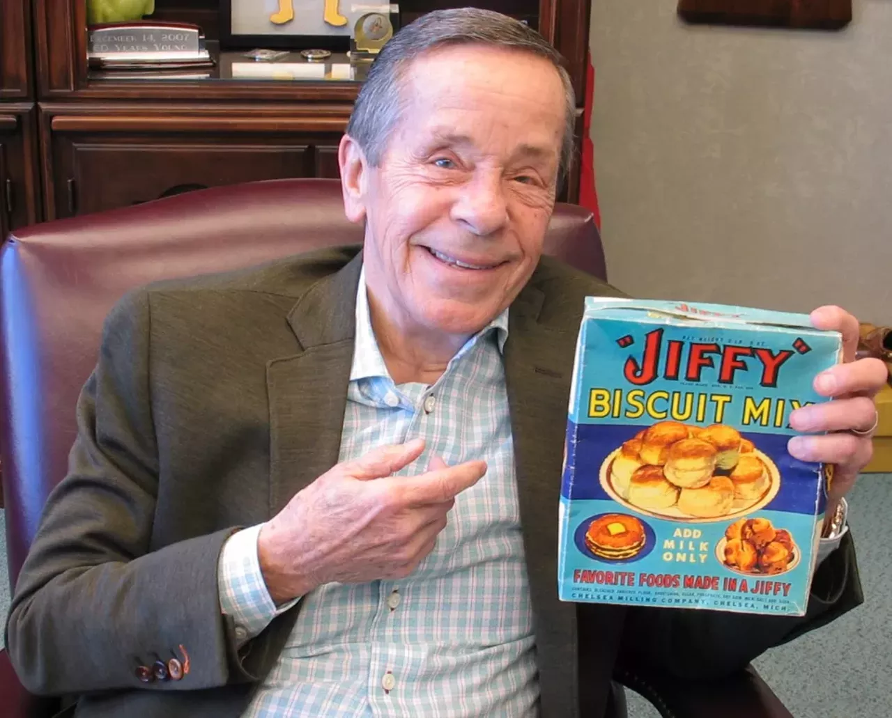 Jiffy Mix "Howdy Holmes with a vintage box of Jiffy Biscuit Mix (circa 1930). Mable White Holmes changed the baking world in 1930 with her paper bag of premixed biscuit ingredients presented to a widowed dad. All he had to do was add liquid. Almost a century later, people still create delicious baked goods “in a jiffy.”"