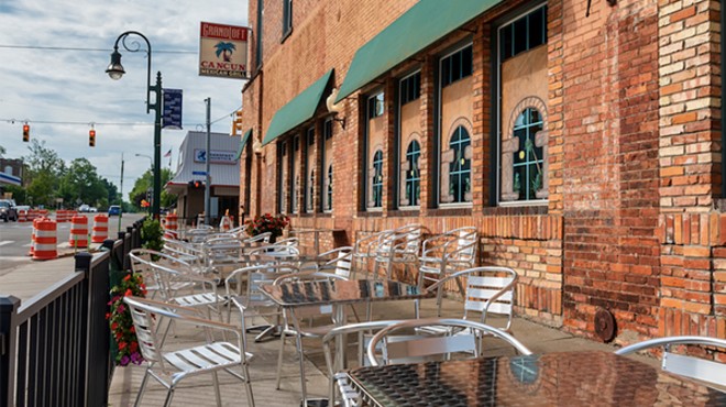View of outside patio furniture for the Cancun Mexican Grill and the Grand Loft business at the corner of Bridge Street and Jefferson in Grand Ledge.