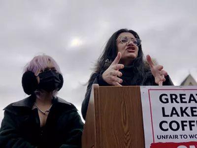 U.S. Rep. Rashida Tlaib speaks at a rally for Great Lakes Roasting Co. in Detroit on Wednesday. To her left is barista Lea Green.