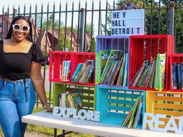 Charmane Neal, founder of Hey Y’all Detroit, with books for children.