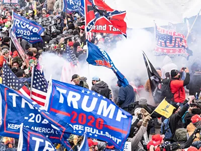 Smoke rises after police used pepper spray against Pro-Trump supporters on Jan. 6, 2021.