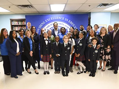 Detroit Academy of Arts & Sciences students and faculty at a news conference Thursday.