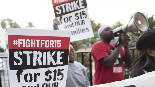 Demonstrators gather for a Fight for $15 protest outside of McDonald's restaurant in Las Vegas.