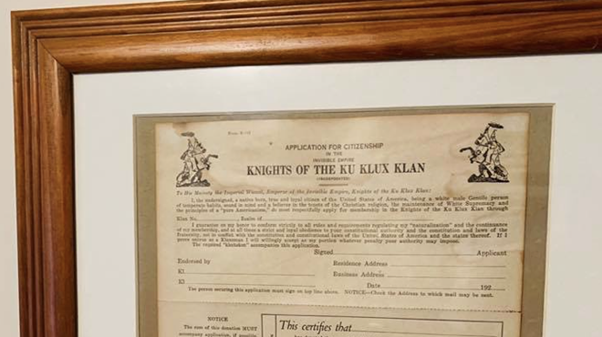 A framed Ku Klux Klan application form was left displayed in the house of a white Michigan police officer while a Black man was there with a real estate agent.