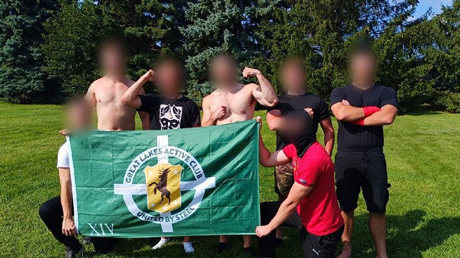 Members of the neofascist Great Lakes Active Club pose with their faces blurred at an undisclosed location.