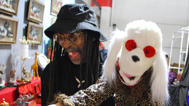 Darrell Banks lip-syncing with his puppet Diamond inside his booth.