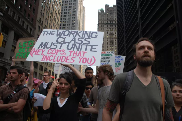 Occupy Wall Street protesters head up Broadway last Friday. A reflection of people "fed up" with their nation's direction, says Maria Svart, head of the Democratic Socialists of America.