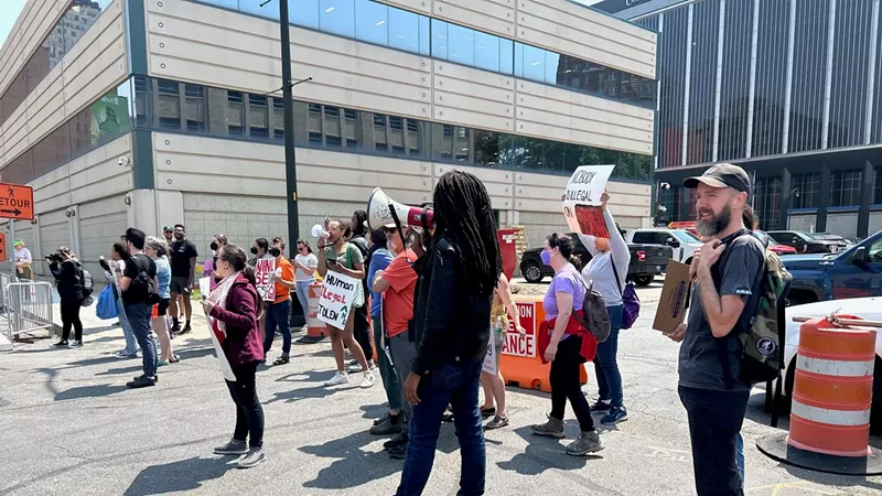 Protesters rallied in downtown Detroit after migrants were detained at the Patrick V. McNamara Federal Building.