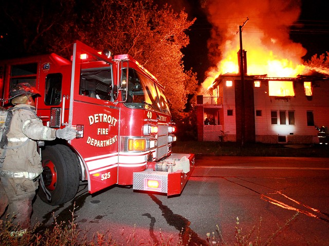 A Detroit firefighter battles a blaze.