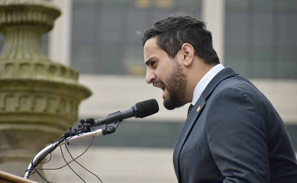 State Rep. Abraham Aiyash (D-Hamtramck) speaks to students and activists at the Michigan Capitol following the Feb. 13, 2023 mass shooting at Michigan State University, Feb. 15, 2023.