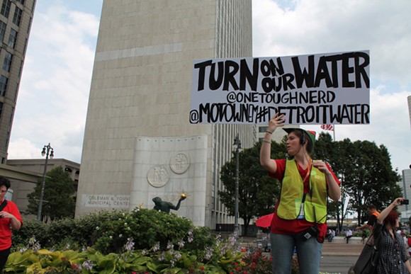 Demonstrator during a protest last year in opposition to water shut-offs in Detroit. - MT file