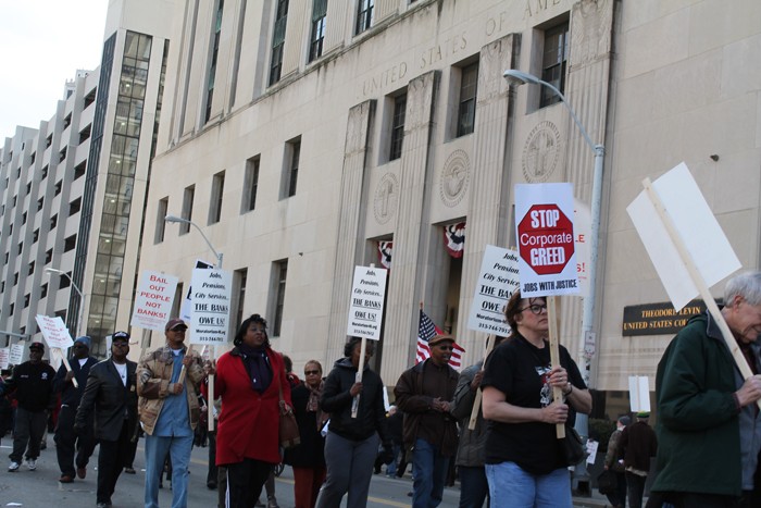 Retirees and supporters gathered outside of the Theodore Levin federal courthouse in downtown Detroit on Tuesday, April 1, to protest Detroit Emergency Manager Kevyn Orr’s proposed bankruptcy-exit plan, which calls for cuts to monthly pension checks. - PHOTO BY RYAN FELTON.