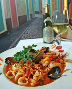 Risotto Marinara: Shrimp, scalops and mussels in a red clam calamari sauce, served over a bed of rice. - MT photo: Rob Widdis