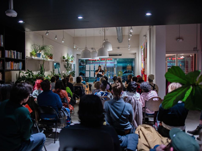 A packed poetry reading at Room Project.