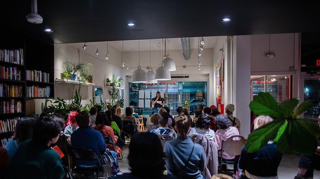 A packed poetry reading at Room Project.