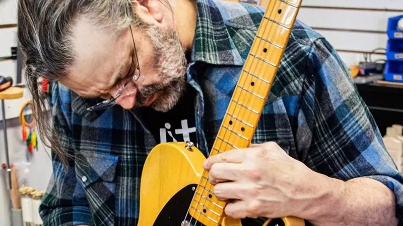 Jason “The Rock Mechanic” Portier makes a repair at Guitar Hi-Fi.