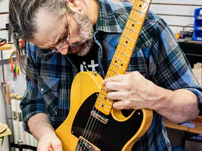 Jason “The Rock Mechanic” Portier makes a repair at Guitar Hi-Fi.