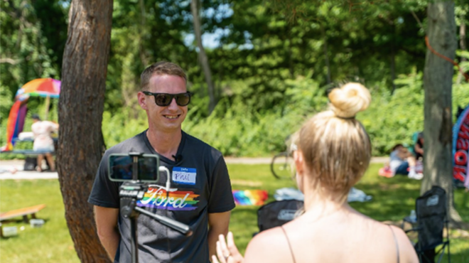 Macomb County Pride President Phil Gilchrist completing an interview during a Pride Picnic in Sterling Heights, June 2021.
