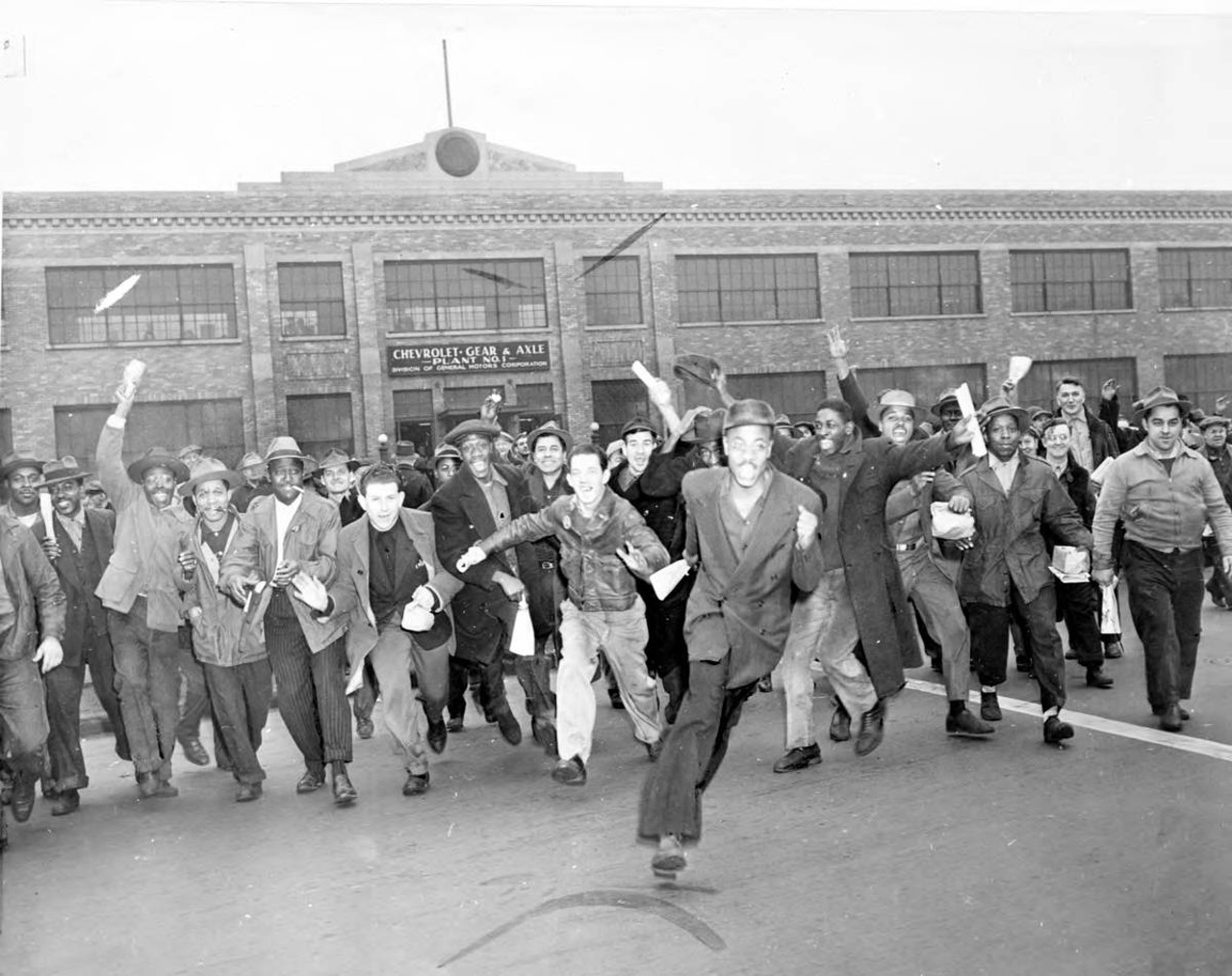 
Nov. 21, 1945: A group of men run from the Chevrolet Gear and Axle plant in Detroit as the UAW-CIO strike against General Motors is launched. The strikers walked, ran, and leaped as they left to begin the walkout, which affected about 100,000 workers in Michigan.