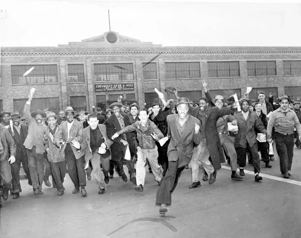  Nov. 21, 1945: A group of men run from the Chevrolet Gear and Axle plant in Detroit as the UAW-CIO strike against General Motors is launched. The strikers walked, ran, and leaped as they left to begin the walkout, which affected about 100,000 workers in Michigan.