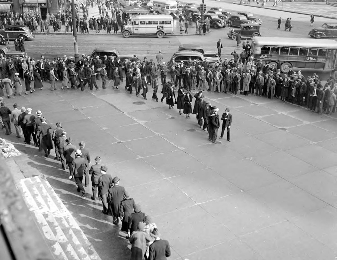 
March 31, 1938: Large group of people picket for UAW march in Detroit near City Hall.