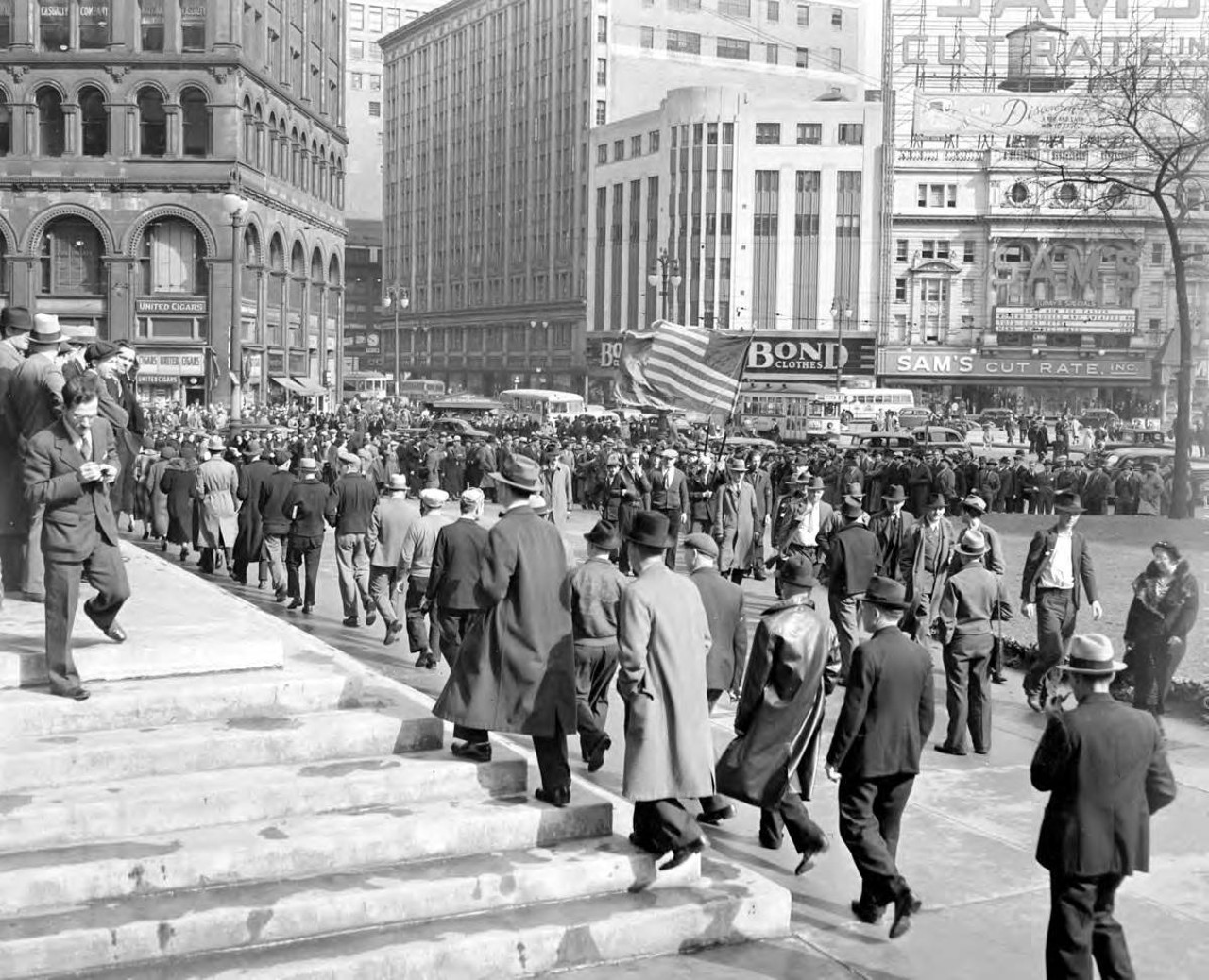 
March 31, 1938: People march at the UAW picket line near Detroit's City Hall.