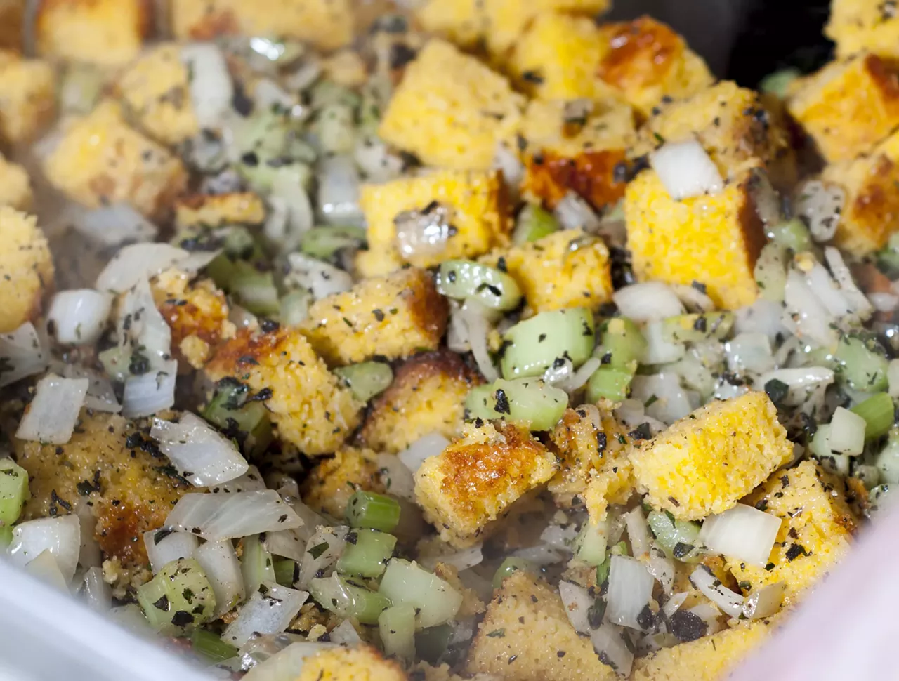 Toss in the cornbread and continue cooking.