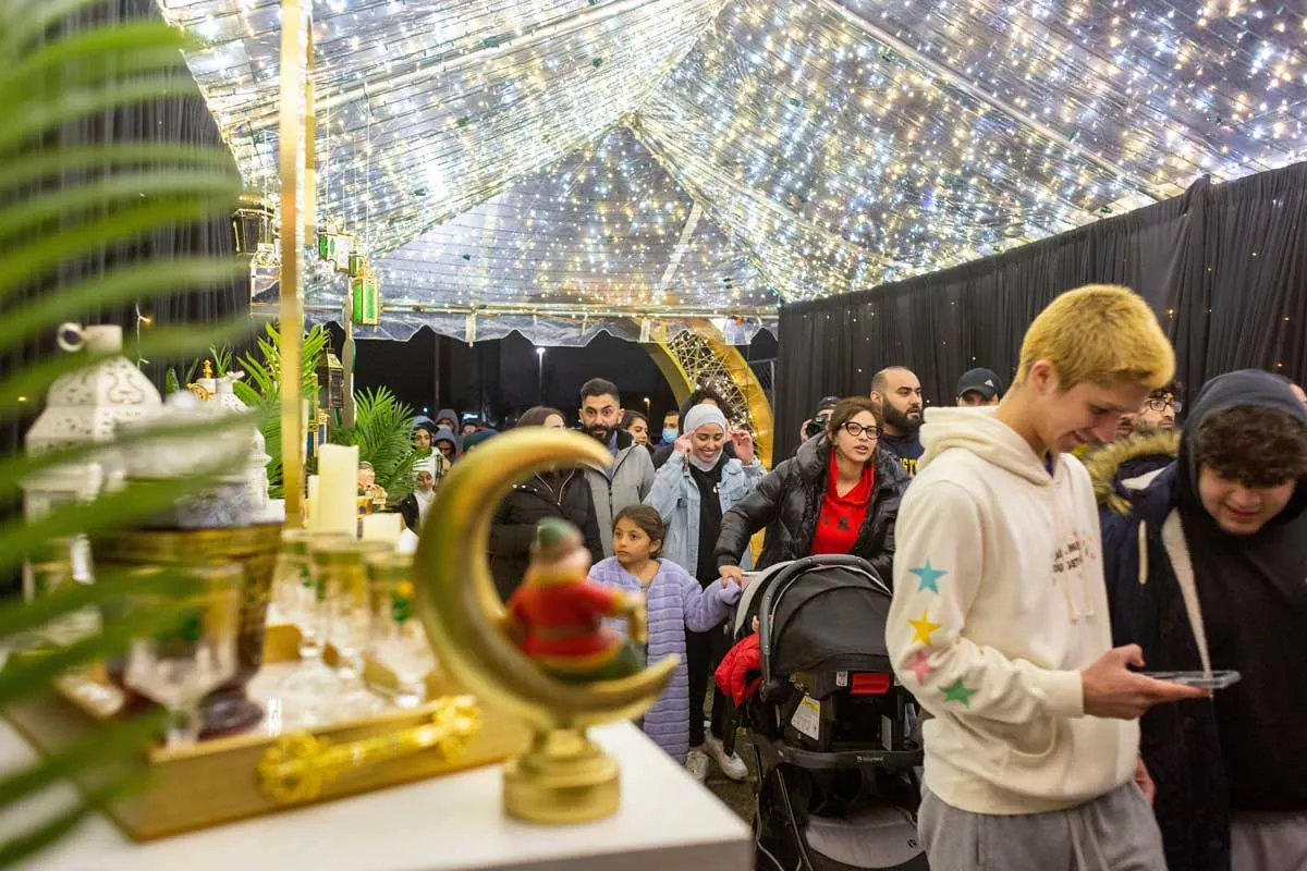 Image: People arrive at Dearborn’s Ramadan Suhoor Festival, which attracts thousands.