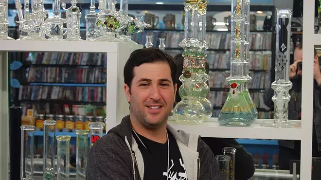Image: Shelby Berger, owner of Cloud 22 Head Shop, Main Street Pawn Shop & Patriot Firearms
