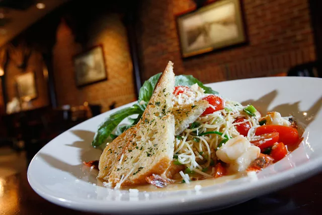 Shrimp scampi with garlic, tomatoes, fresh basil and green onions in lemon butter and tossed with angel hair pasta. - Rob Widdis