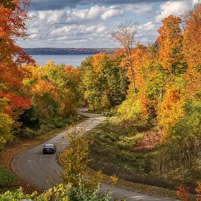 Traverse City If Michigan had a version of The Hamptons, it would be Traverse City. While we might enjoy Traverse City in the summer (and occasionally get wine drunk there), Traverse City has beautiful views of mountains and trees making it ideal for fall colors.