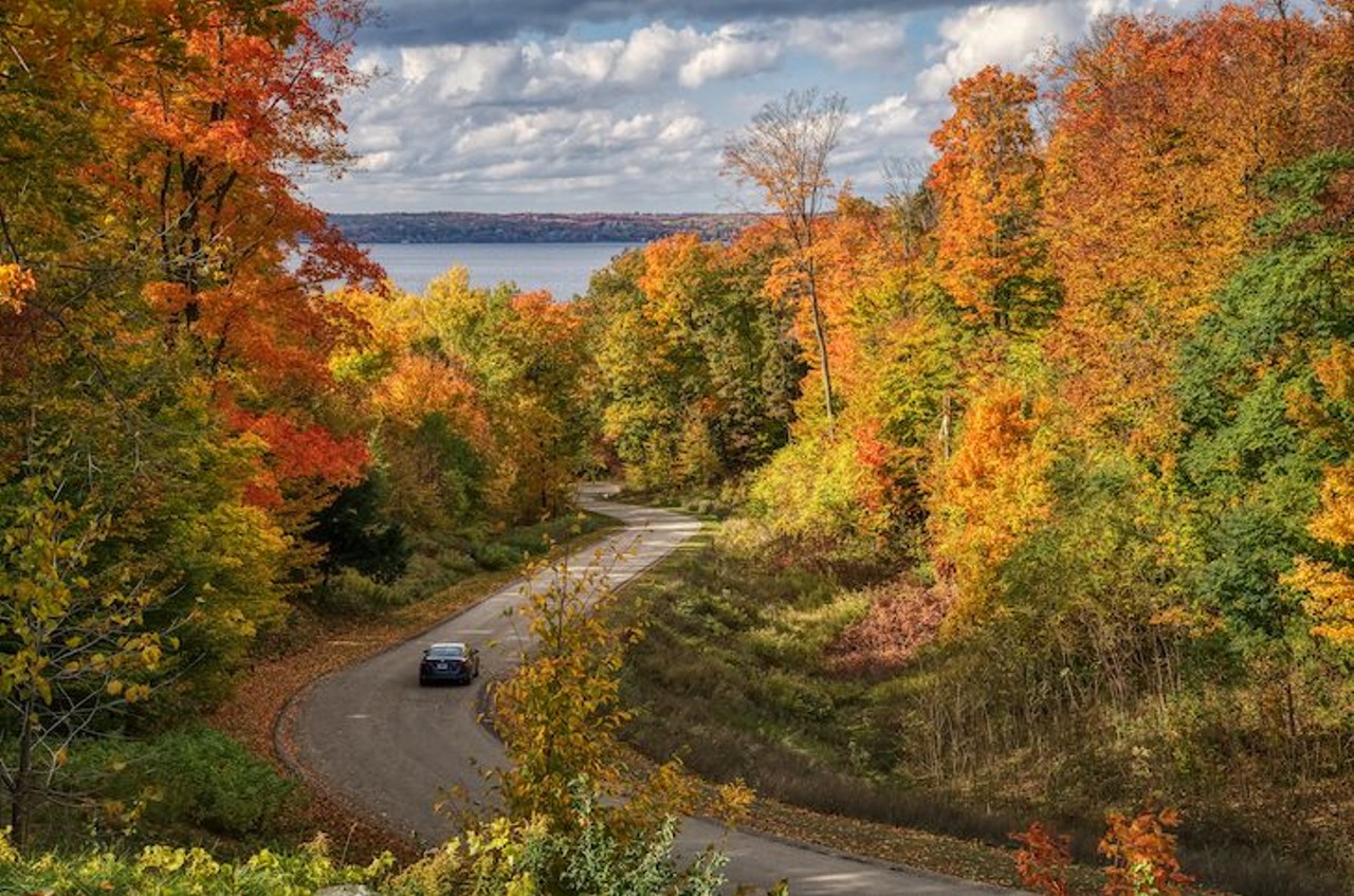 Traverse City
If Michigan had a version of The Hamptons, it would be Traverse City. While we might enjoy Traverse City in the summer (and occasionally get wine drunk there), Traverse City has beautiful views of mountains and trees making it ideal for fall colors.